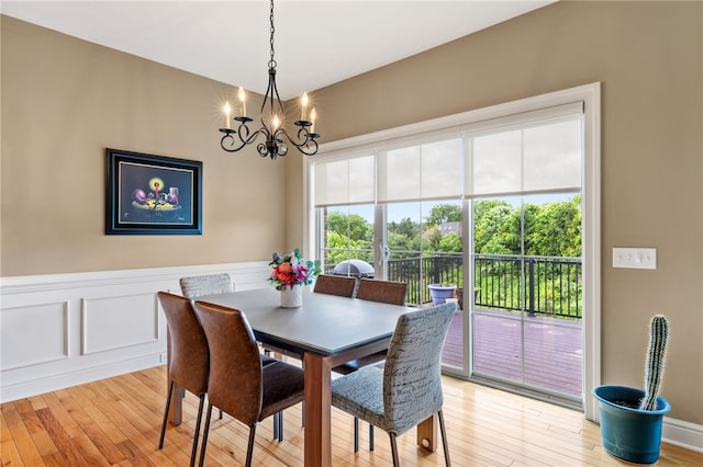 209 Lucca Ln, Upper St Clair, PA 15241 - dining space featuring a chandelier, light wood-style floors, and wainscoting
