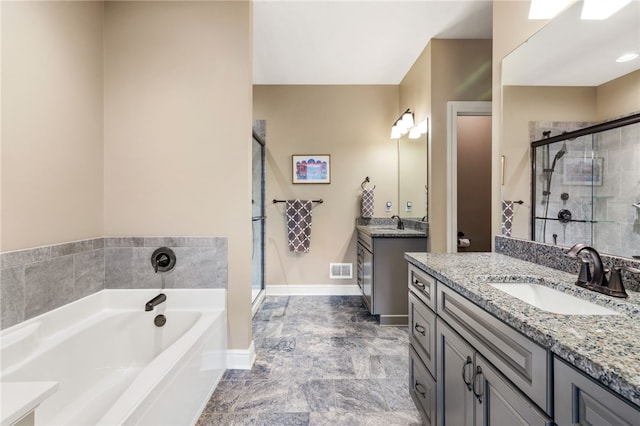 209 Lucca Ln, Upper St Clair, PA 15241 - bathroom featuring a stall shower, two vanities, a garden tub, and baseboards