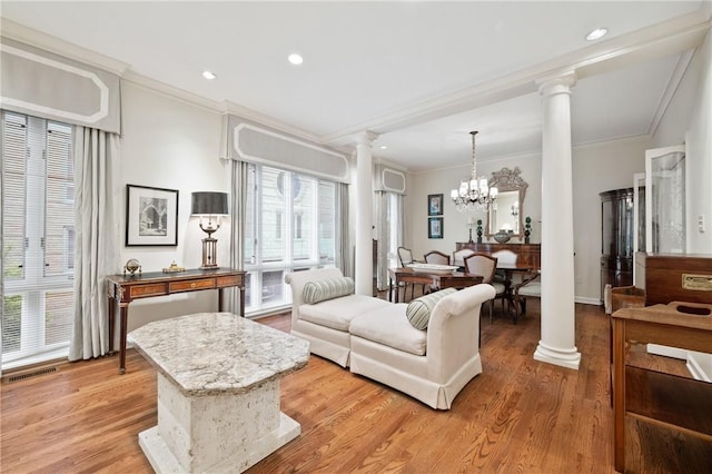 202 N Woodland Rd, Shadyside, PA 15232 - living room with ornate columns, ornamental molding, light wood-type flooring, a chandelier, and recessed lighting