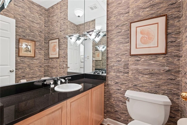 202 N Woodland Rd, Shadyside, PA 15232 - bathroom featuring toilet, vanity, and tile walls