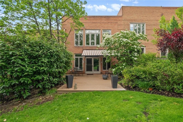 202 N Woodland Rd, Shadyside, PA 15232 - rear view of house with a yard, brick siding, a standing seam roof, and a wooden deck