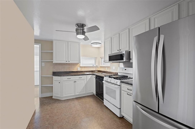 3353 Mcroberts Rd, Castle Shannon, PA 15234 - kitchen featuring stainless steel appliances, open shelves, ceiling fan, dark countertops, and white cabinetry