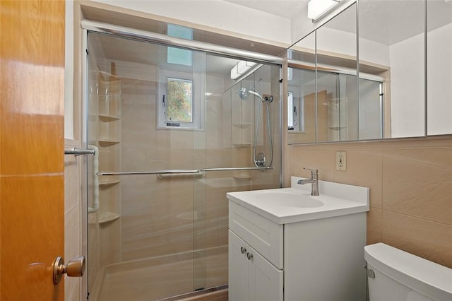 3353 Mcroberts Rd, Castle Shannon, PA 15234 - bathroom with toilet, vanity, a shower stall, and tile walls