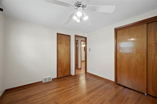 3353 Mcroberts Rd, Castle Shannon, PA 15234 - unfurnished bedroom featuring light wood finished floors, baseboards, and ceiling fan