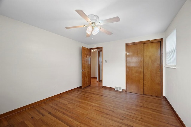 3353 Mcroberts Rd, Castle Shannon, PA 15234 - unfurnished bedroom with light wood-type flooring, baseboards, and a closet
