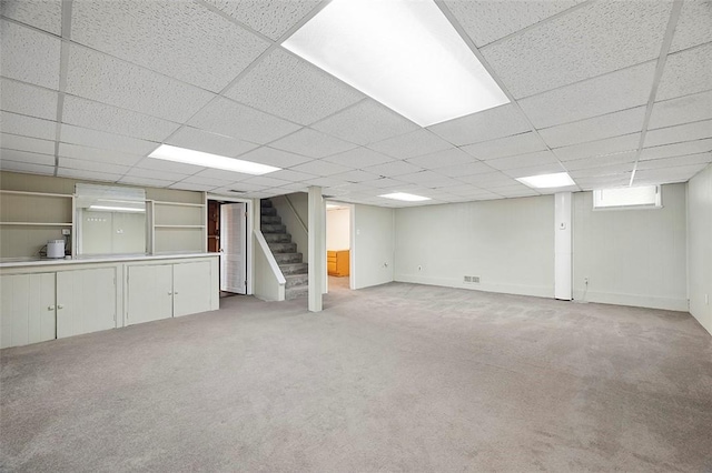 3353 Mcroberts Rd, Castle Shannon, PA 15234 - basement with stairs, light colored carpet, a paneled ceiling, and baseboards