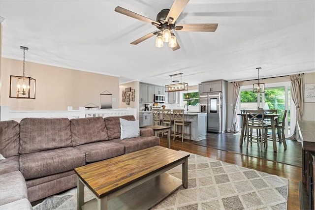 6003 Kingston Dr, Hopewell Twp Bea, PA 15001 - living area featuring wood finished floors, ceiling fan, and a chandelier