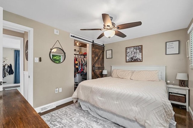 6003 Kingston Dr, Hopewell Twp Bea, PA 15001 - bedroom with a barn door, wood finished floors, and baseboards