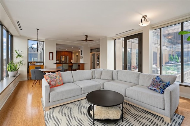 151 Fort Pitt Blvd Unit 1703, Downtown Pgh, PA 15222 - living area featuring light wood-type flooring, healthy amount of natural light, and baseboards