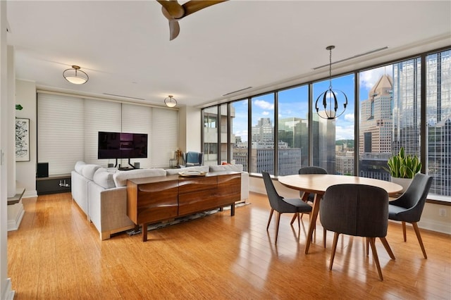 151 Fort Pitt Blvd Unit 1703, Downtown Pgh, PA 15222 - living room with light wood finished floors, plenty of natural light, and ceiling fan