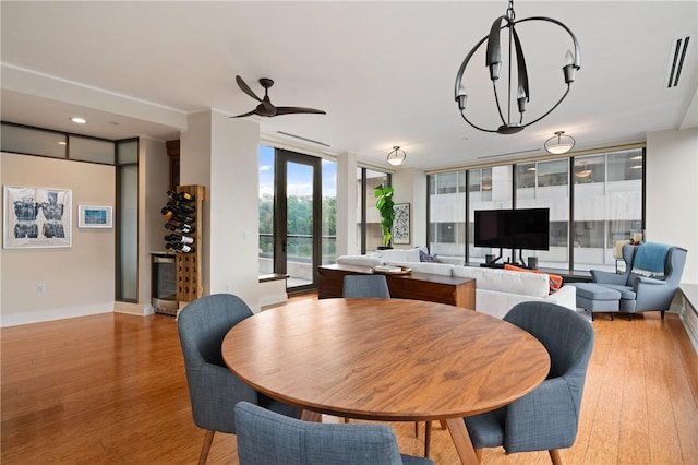 151 Fort Pitt Blvd Unit 1703, Downtown Pgh, PA 15222 - dining room with light wood-style floors, expansive windows, baseboards, and a ceiling fan