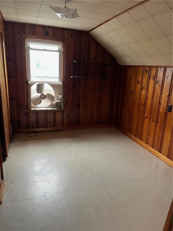 256 Vermont St, Hempfield Twp Wml, PA 15601 - bonus room featuring tile patterned floors, wood walls, and lofted ceiling