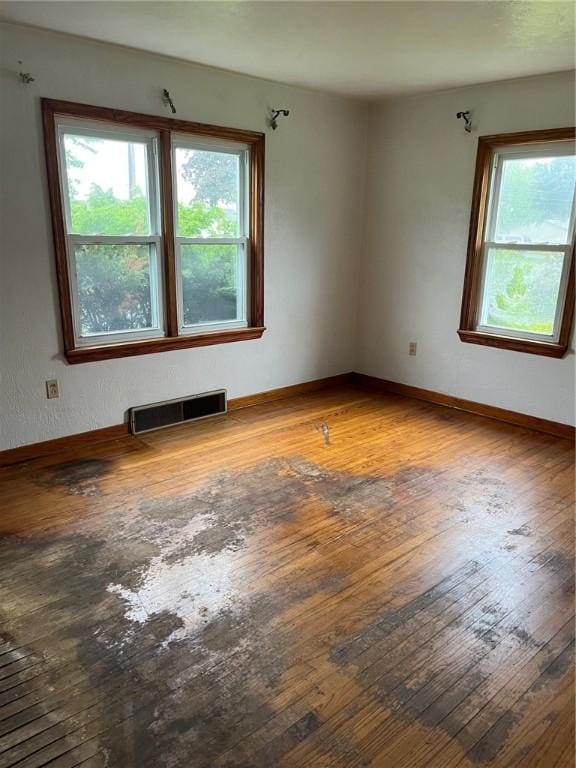 256 Vermont St, Hempfield Twp Wml, PA 15601 - spare room featuring wood-type flooring, plenty of natural light, and baseboards