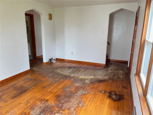 256 Vermont St, Hempfield Twp Wml, PA 15601 - spare room featuring hardwood / wood-style floors, arched walkways, and baseboards