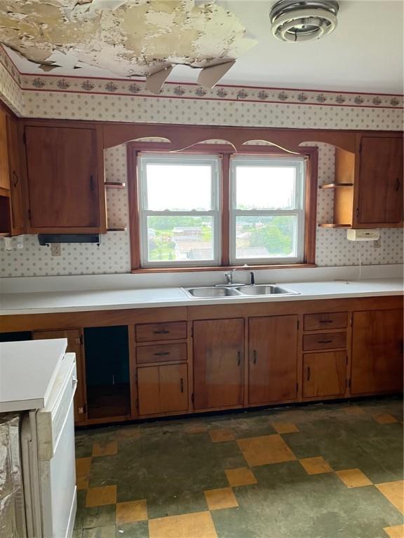256 Vermont St, Hempfield Twp Wml, PA 15601 - kitchen featuring a sink, light countertops, wallpapered walls, and open shelves
