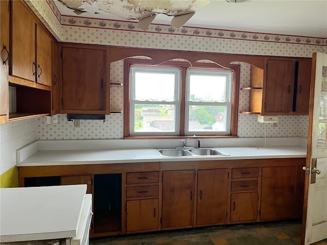 256 Vermont St, Hempfield Twp Wml, PA 15601 - kitchen featuring open shelves, a sink, wallpapered walls, brown cabinetry, and light countertops