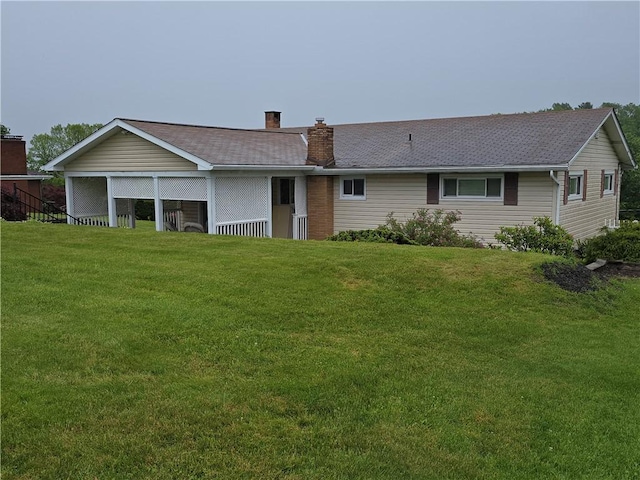 209 Pawnee St, Rostraver, PA 15012 - rear view of house with a chimney and a yard