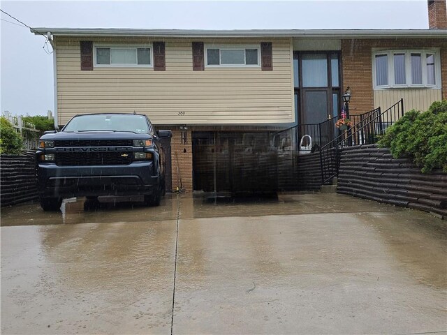 209 Pawnee St, Rostraver, PA 15012 - view of front facade with driveway and stairs