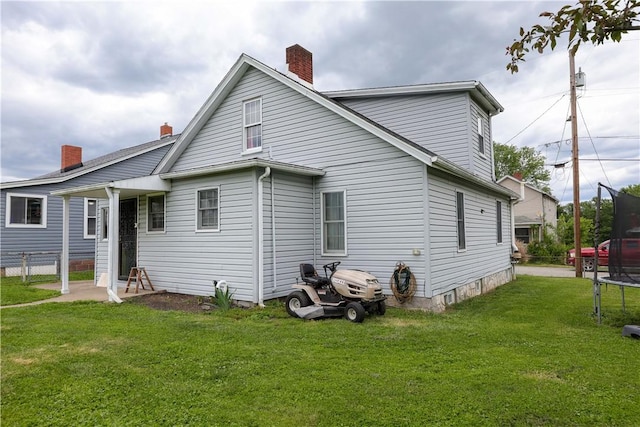 1019 Boulder St, California, PA 15419 - back of property featuring a trampoline and a chimney