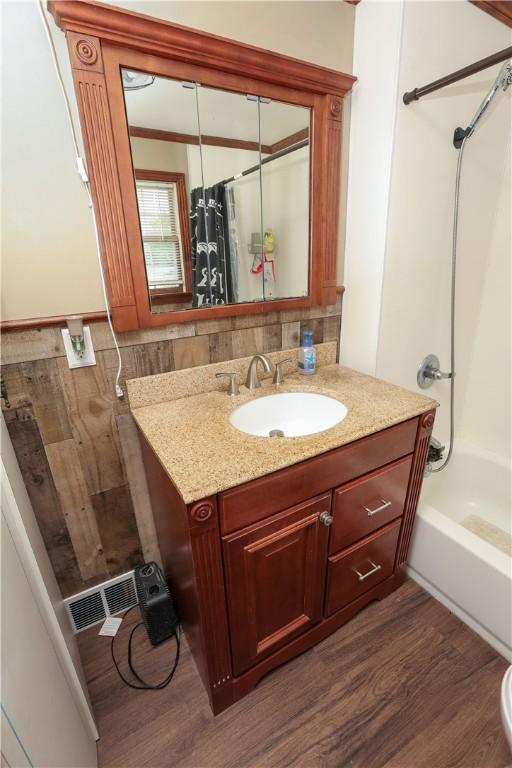 1019 Boulder St, California, PA 15419 - bathroom with vanity, wood finished floors, and shower / tub combo with curtain