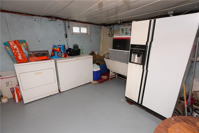 1019 Boulder St, California, PA 15419 - basement with washing machine and dryer, white fridge with ice dispenser, and fridge