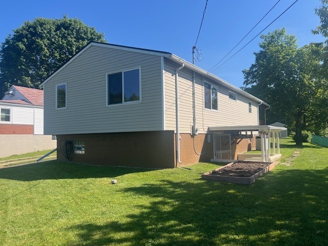 1320 High, Jefferson Hills, PA 15025 - rear view of house with a yard