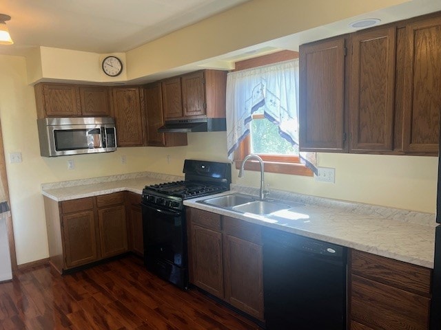 1320 High, Jefferson Hills, PA 15025 - kitchen featuring black appliances, under cabinet range hood, a sink, dark wood-type flooring, and light countertops