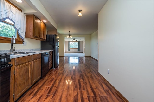 1320 High, Jefferson Hills, PA 15025 - kitchen with black appliances, brown cabinetry, light countertops, and dark wood finished floors