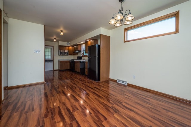 1320 High, Jefferson Hills, PA 15025 - kitchen with black appliances, a chandelier, dark wood finished floors, and plenty of natural light