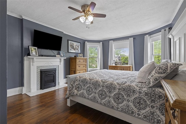 194 Beaver St, Beaver, PA 15009 - bedroom featuring a textured ceiling, hardwood / wood-style flooring, ornamental molding, a fireplace, and ceiling fan