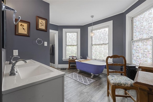 194 Beaver St, Beaver, PA 15009 - full bath featuring a freestanding tub, ornamental molding, wood finished floors, baseboards, and double vanity