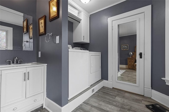 194 Beaver St, Beaver, PA 15009 - laundry area featuring washer and clothes dryer, cabinet space, dark wood-type flooring, crown molding, and baseboards