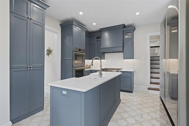 194 Beaver St, Beaver, PA 15009 - kitchen featuring stainless steel appliances, custom exhaust hood, backsplash, light countertops, and glass insert cabinets