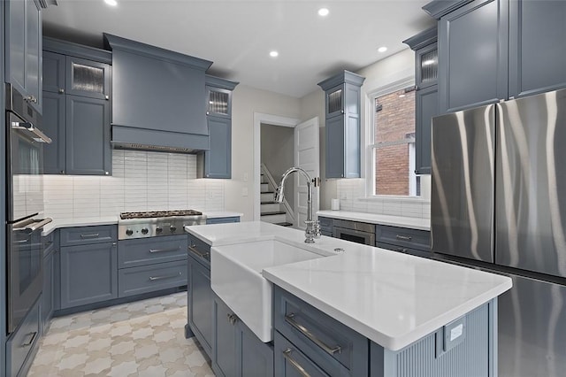 194 Beaver St, Beaver, PA 15009 - kitchen featuring appliances with stainless steel finishes, a sink, recessed lighting, light countertops, and backsplash