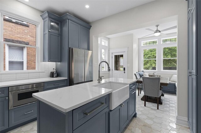 194 Beaver St, Beaver, PA 15009 - kitchen with freestanding refrigerator, a sink, built in microwave, light countertops, and a ceiling fan