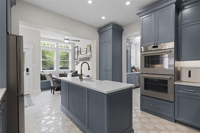 194 Beaver St, Beaver, PA 15009 - kitchen with appliances with stainless steel finishes, a sink, recessed lighting, light countertops, and a ceiling fan