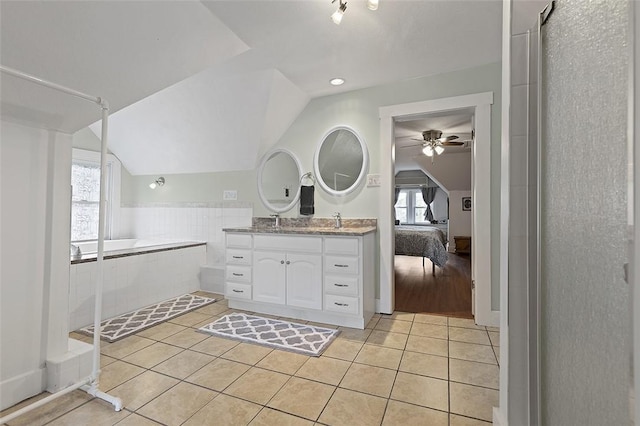 194 Beaver St, Beaver, PA 15009 - ensuite bathroom with lofted ceiling, tile patterned flooring, vanity, a bath, and a ceiling fan
