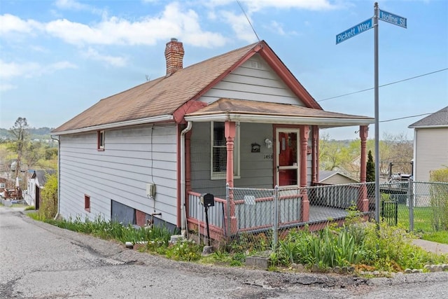 1458 Isoline, Sheraden, PA 15204 - view of front of property featuring covered porch, a chimney, and a shingled roof