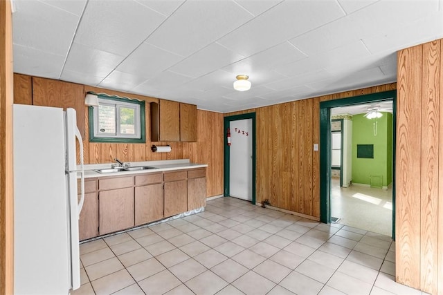 1458 Isoline, Sheraden, PA 15204 - kitchen featuring freestanding refrigerator, a sink, light countertops, wooden walls, and brown cabinetry
