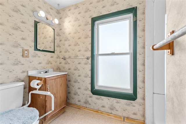 1458 Isoline, Sheraden, PA 15204 - bathroom featuring vanity, toilet, wallpapered walls, and baseboards
