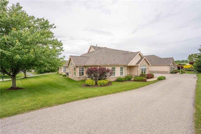 6055 Triple Crown Cir, Hempfield Twp Wml, PA 15601 - single story home featuring stone siding, asphalt driveway, a front lawn, and an attached garage