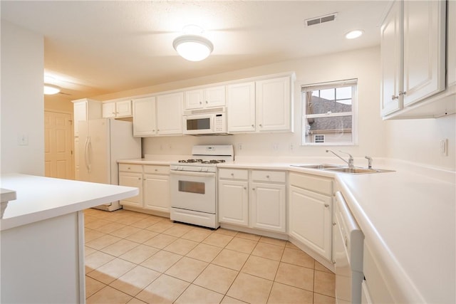 6055 Triple Crown Cir, Hempfield Twp Wml, PA 15601 - kitchen with white appliances, a sink, white cabinets, light tile patterned floors, and light countertops