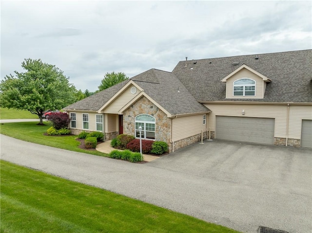 6055 Triple Crown Cir, Hempfield Twp Wml, PA 15601 - view of front facade with stone siding, driveway, a front lawn, and roof with shingles