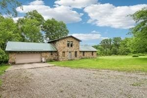 929 Al Smith Dr, Kennedy Twp, PA 15136 - traditional-style house with an attached garage, dirt driveway, and a front yard