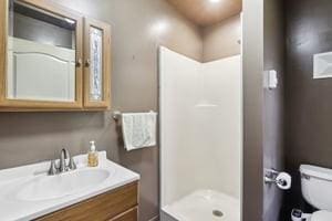 929 Al Smith Dr, Kennedy Twp, PA 15136 - bathroom featuring vanity, toilet, and a shower stall