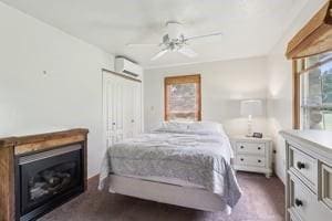929 Al Smith Dr, Kennedy Twp, PA 15136 - bedroom with an AC wall unit, ceiling fan, and dark carpet