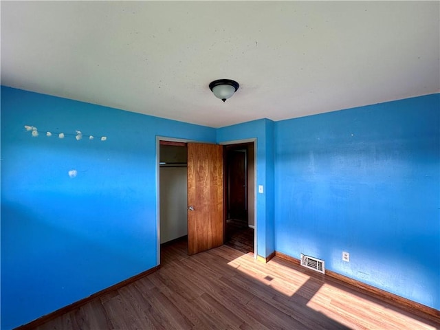 3406 New Castle, West Middlesex Boro, PA 16159 - unfurnished bedroom featuring baseboards, wood finished floors, and a closet