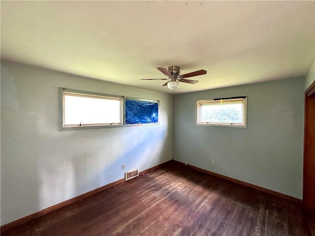 3406 New Castle, West Middlesex Boro, PA 16159 - empty room with dark wood-type flooring, ceiling fan, and baseboards