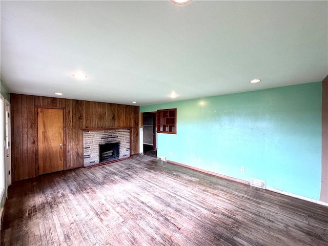 3406 New Castle, West Middlesex Boro, PA 16159 - unfurnished living room with wood finished floors, a fireplace, recessed lighting, and baseboards