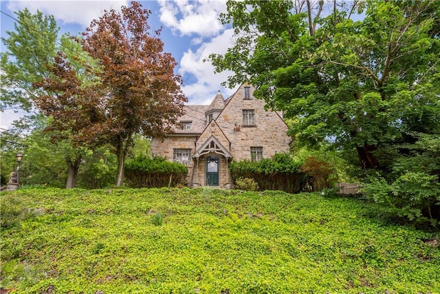 2 Crescent Dr, Mt Lebanon, PA 15228 - tudor-style house with stone siding and a high end roof